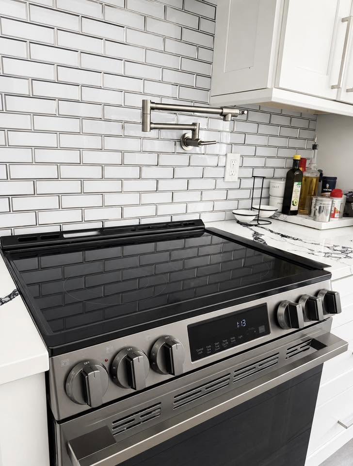 Bright, spotless kitchen with marble countertops